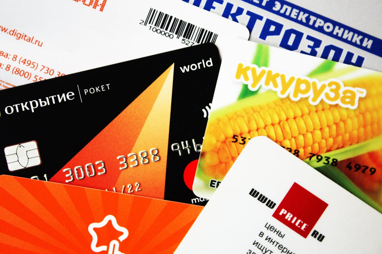 creative-02 A mix of various credit and gift cards, showcasing a close-up view.