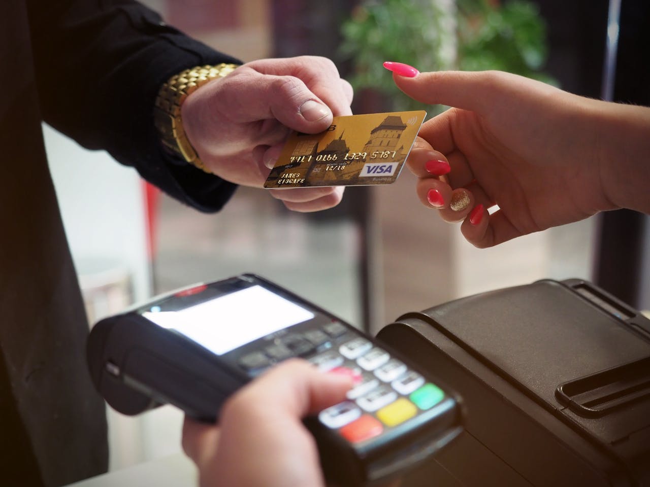 digital-01 Close-up of a credit card payment being processed at a POS terminal.